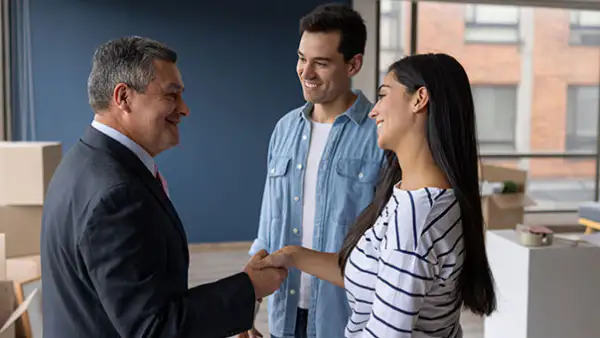 Young couple meets an older man at a house