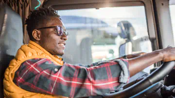 Truck driver uses steering wheel