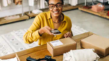 Woman scans code on package