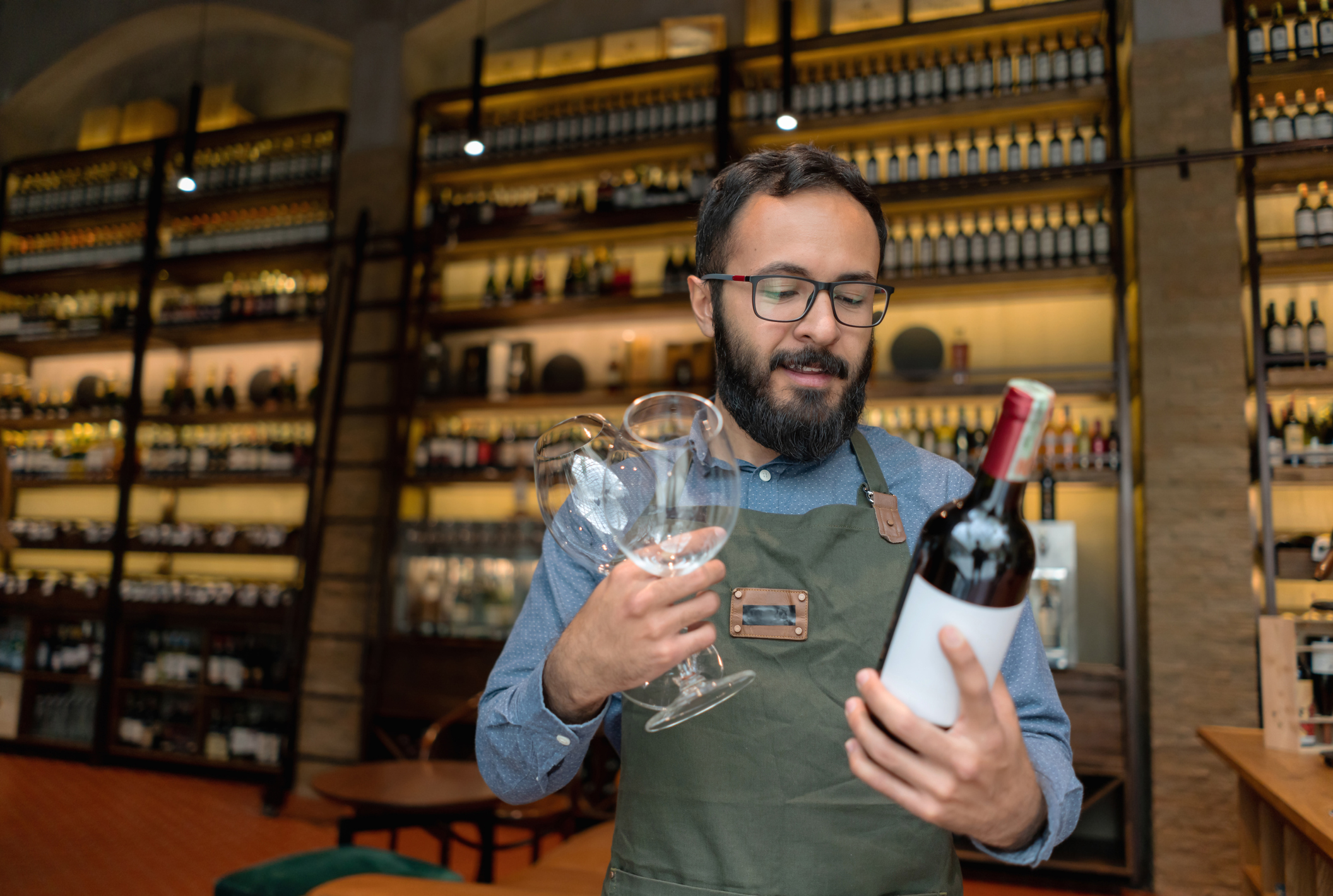 Man looking at wine bottles