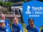 biBerk employees pose for picture after winning award